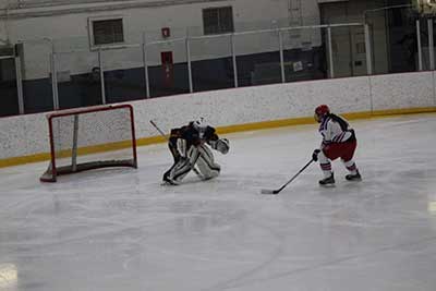 Photography of Laurence playing hockey