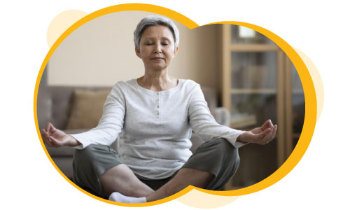 Woman with osteoarthritis meditating